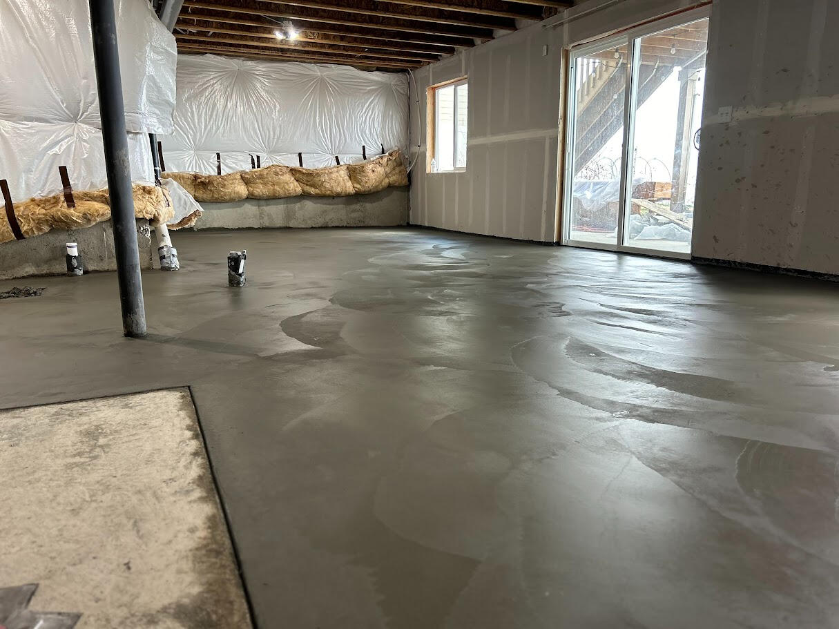 Up-close slick troweled concrete basement floor in Windsor, CO