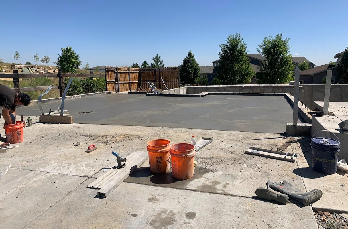 Residential concrete slab pour rebuilding damaged home in Longmont, Colorado